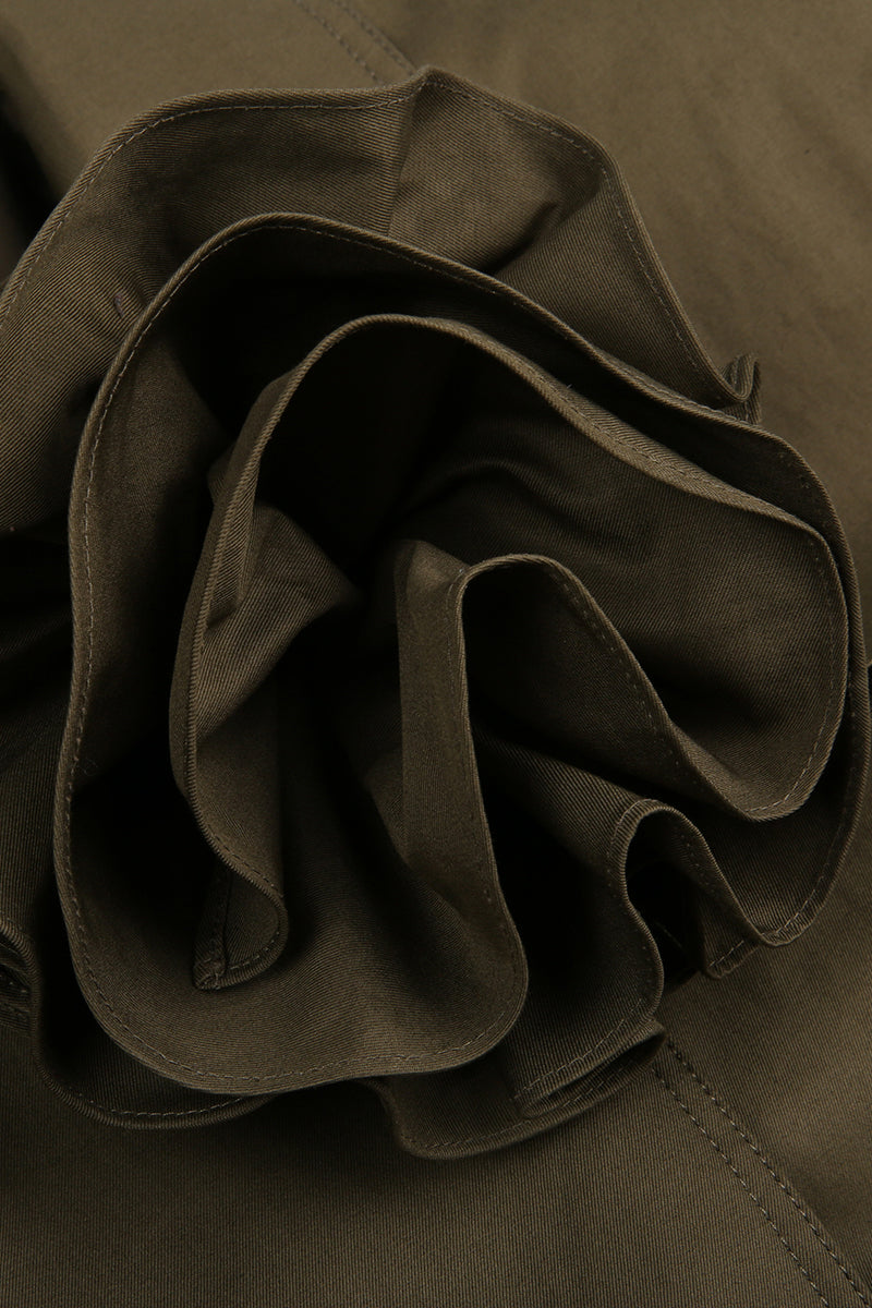 Close-up of a ruffled fabric detail on a brown garment