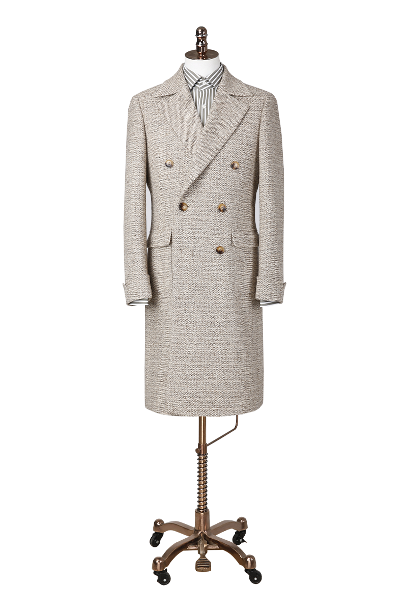 Herringbone patterned overcoat on a mannequin against a white background custom made suits and over coats online sale