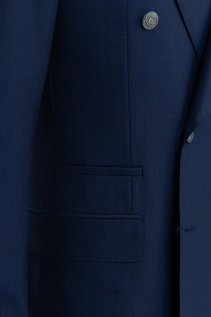 Close-up of a navy blue suit jacket with a button and pocket detail. business blazer