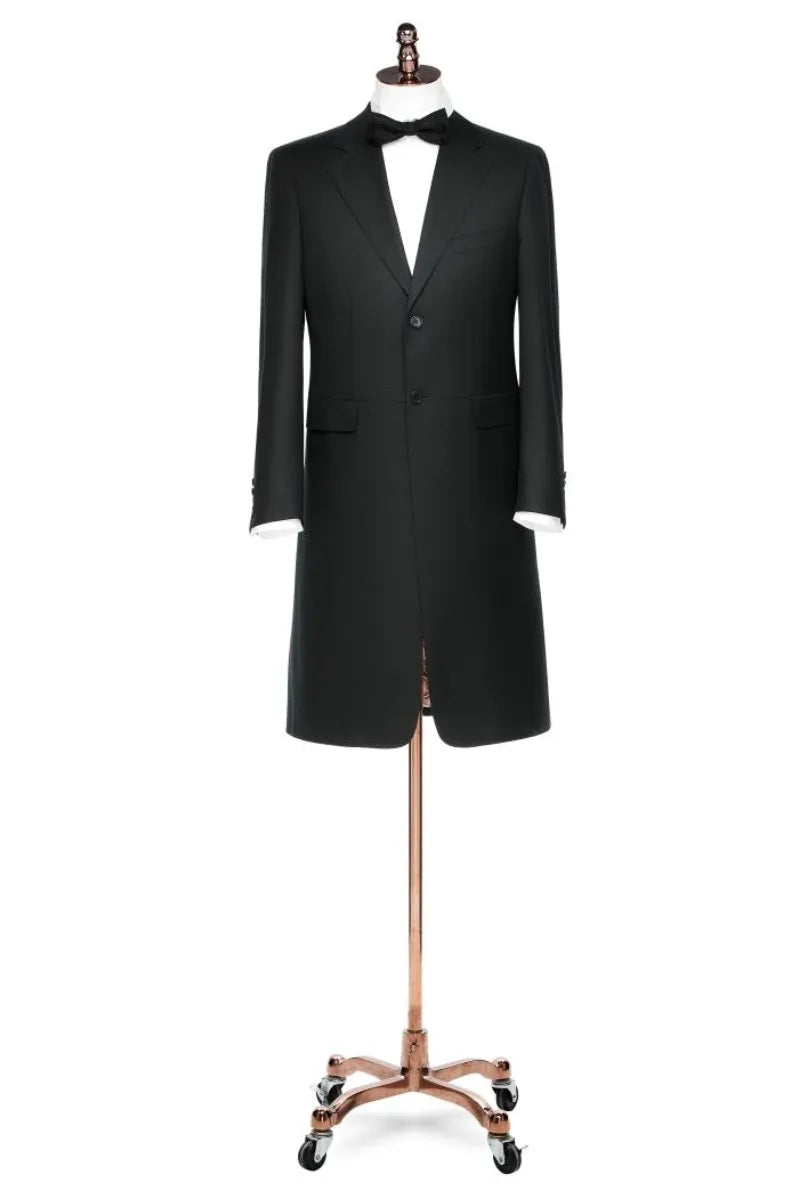 Black tuxedo on a mannequin against a white background