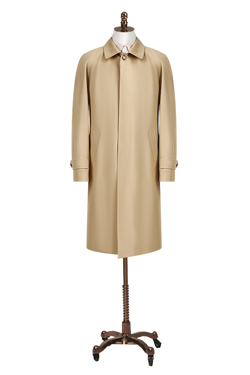 Beige trench coat on a mannequin against a white background