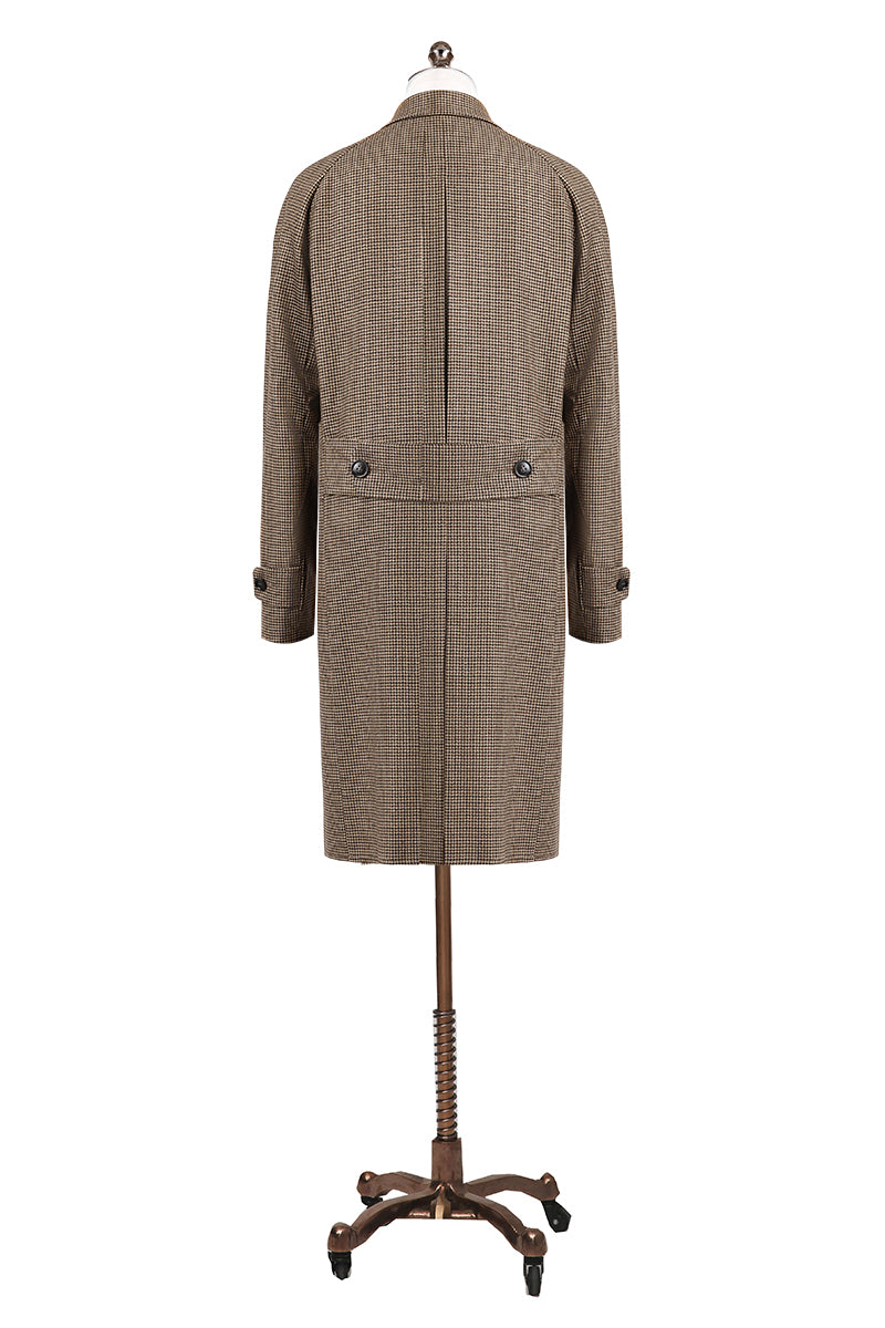 Brown checkered coat on a mannequin against a white background