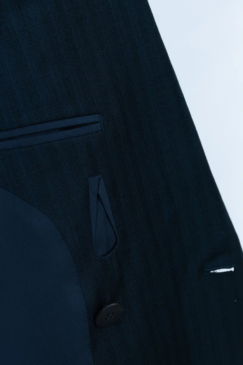 Close-up of a dark blue suit jacket with a button and pocket detailstyish suits near cherry hill