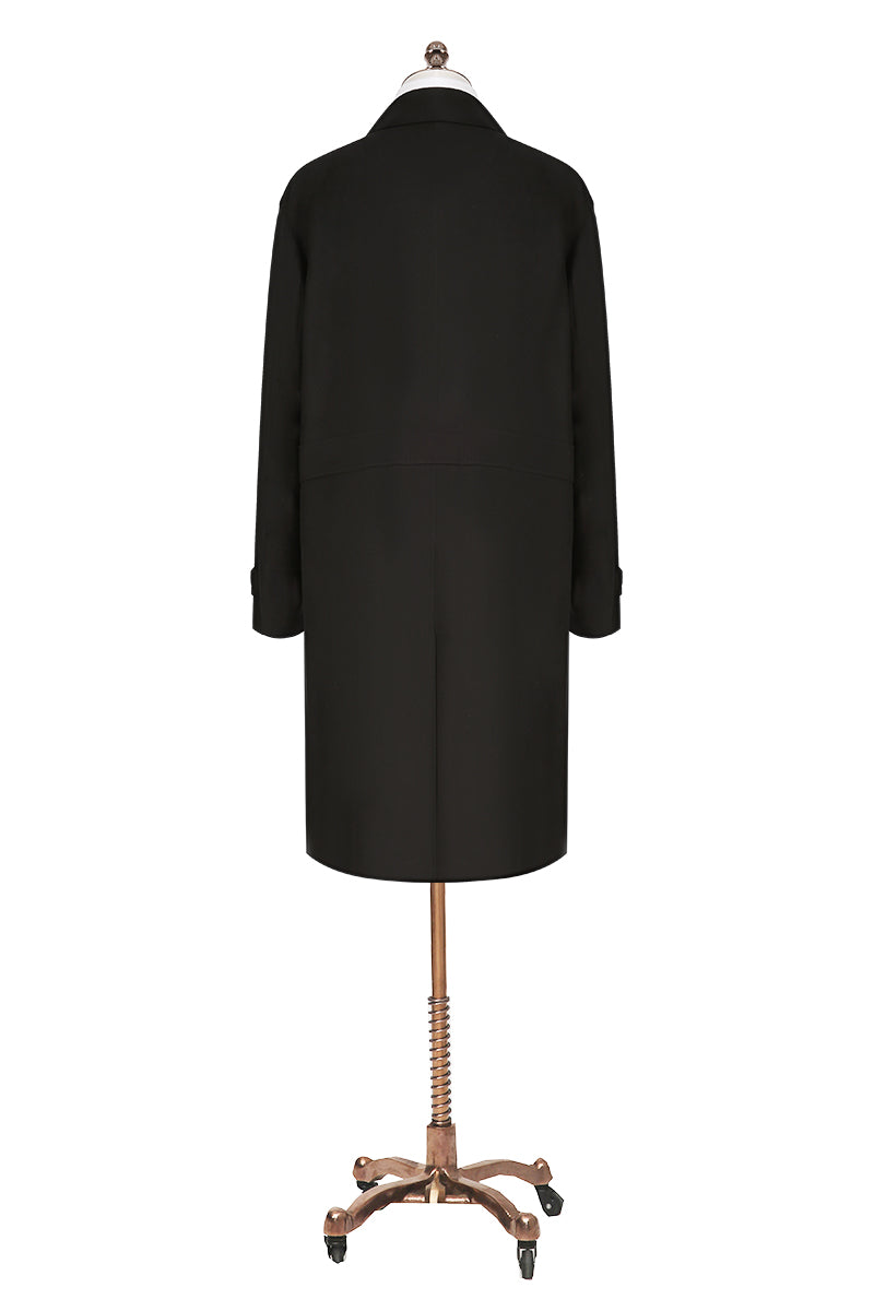 Black coat on a mannequin with a white background