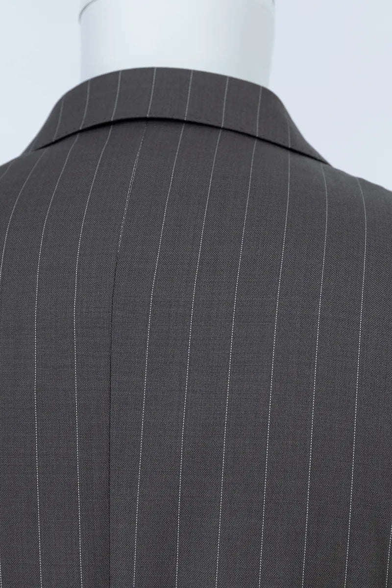 Gray pinstripe suit jacket on a mannequin with a white tailored gray suit