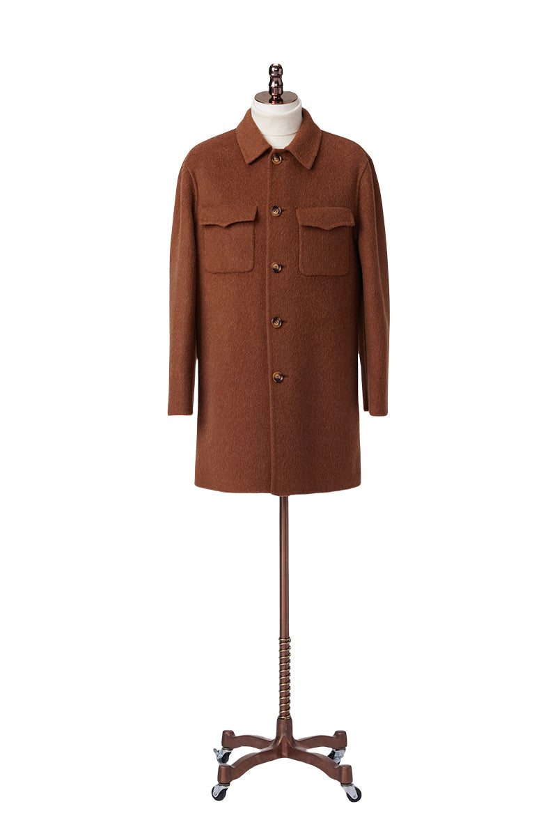 Brown coat on a mannequin against a white background custom made jackets for men and women new york jacksonville florida and washington dc 