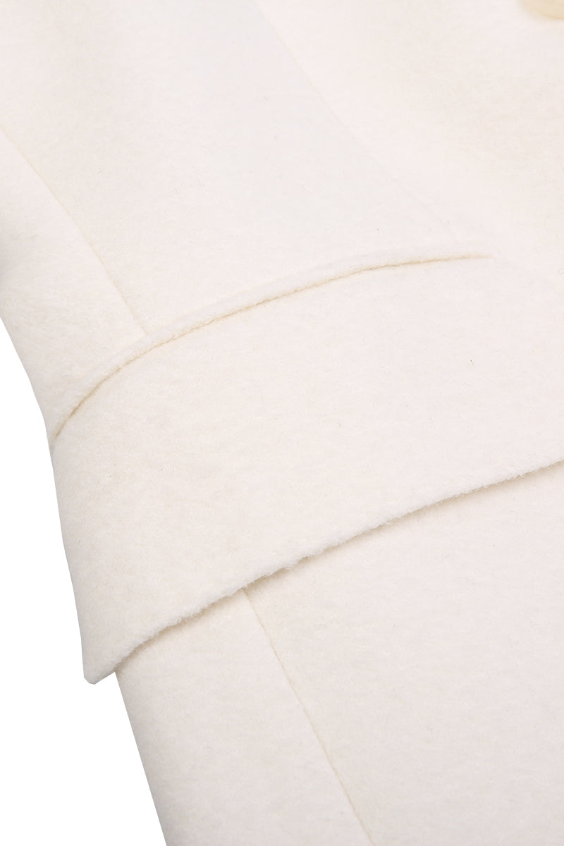 Close-up of a white pillow with a subtle pattern on a white background custom suits indiana