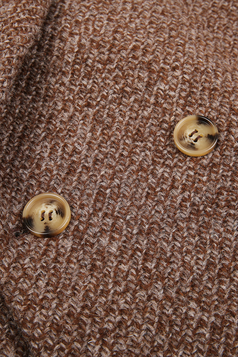 Close-up of a brown textured fabric with two gold buttons. tweed custom suit jacket
