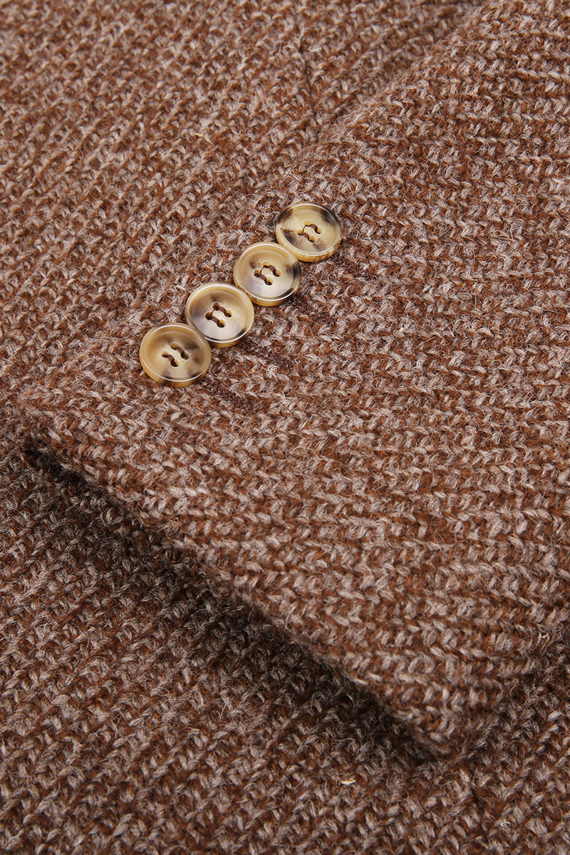 Close-up of a brown textured fabric with four gold buttons. custom made overcoats online