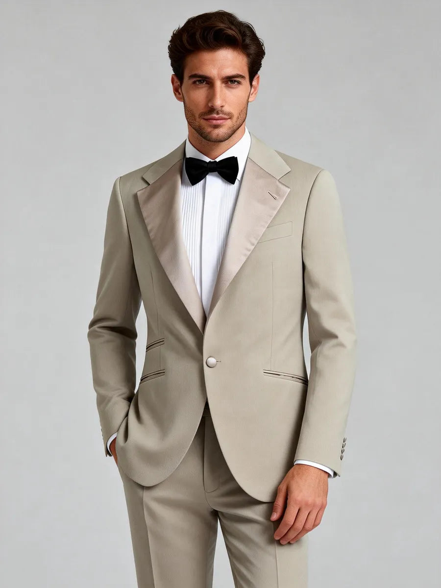 Man wearing a beige tuxedo with a black bow tie Italian Custom Tuxedos