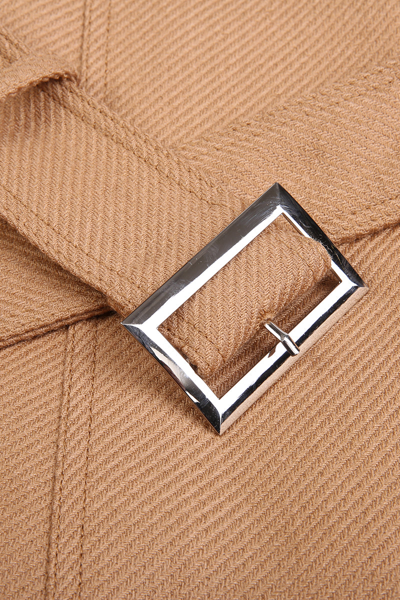 Close-up of a brown fabric with a silver buckle