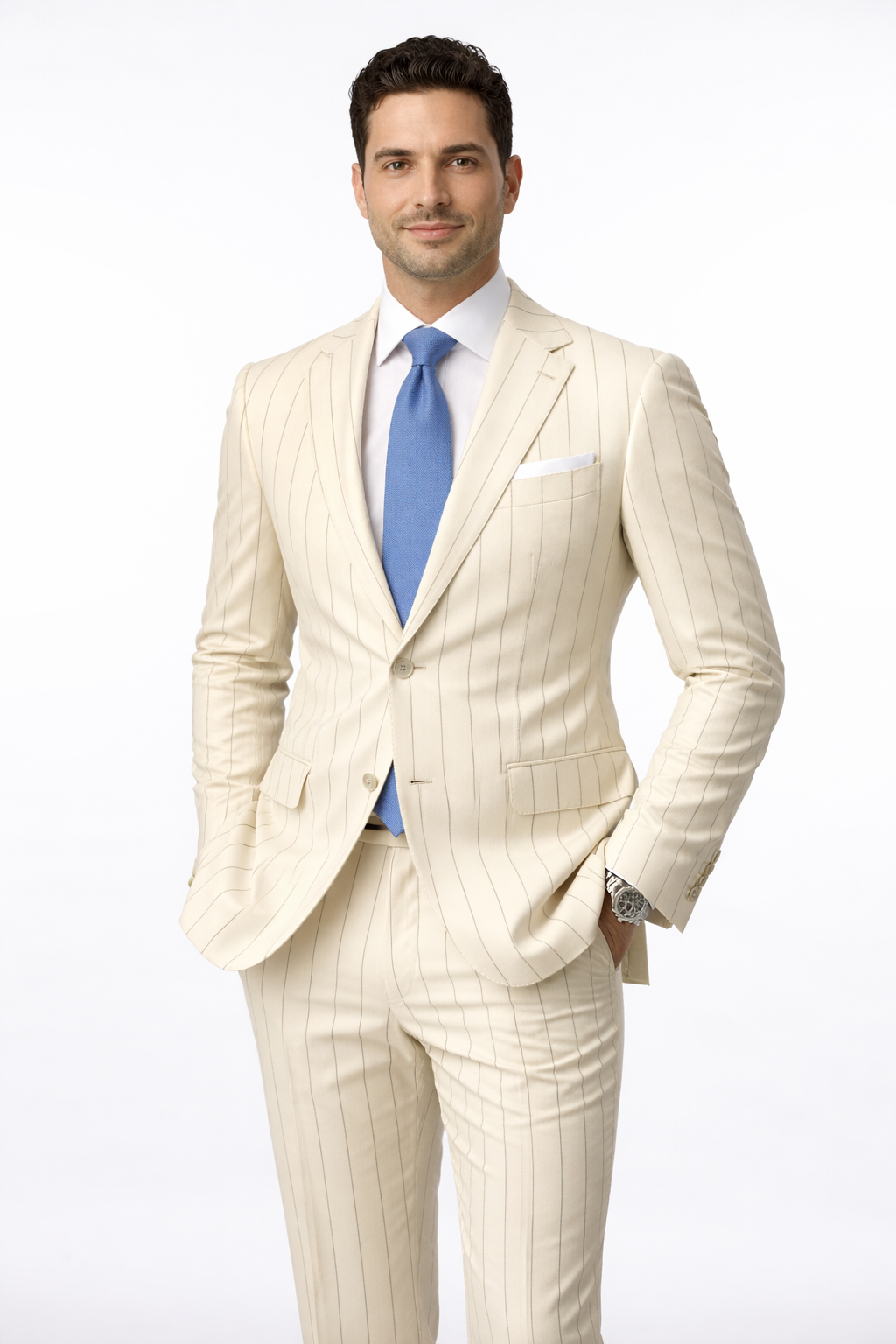Man wearing a cream pinstripe suit with a blue tie on a white background