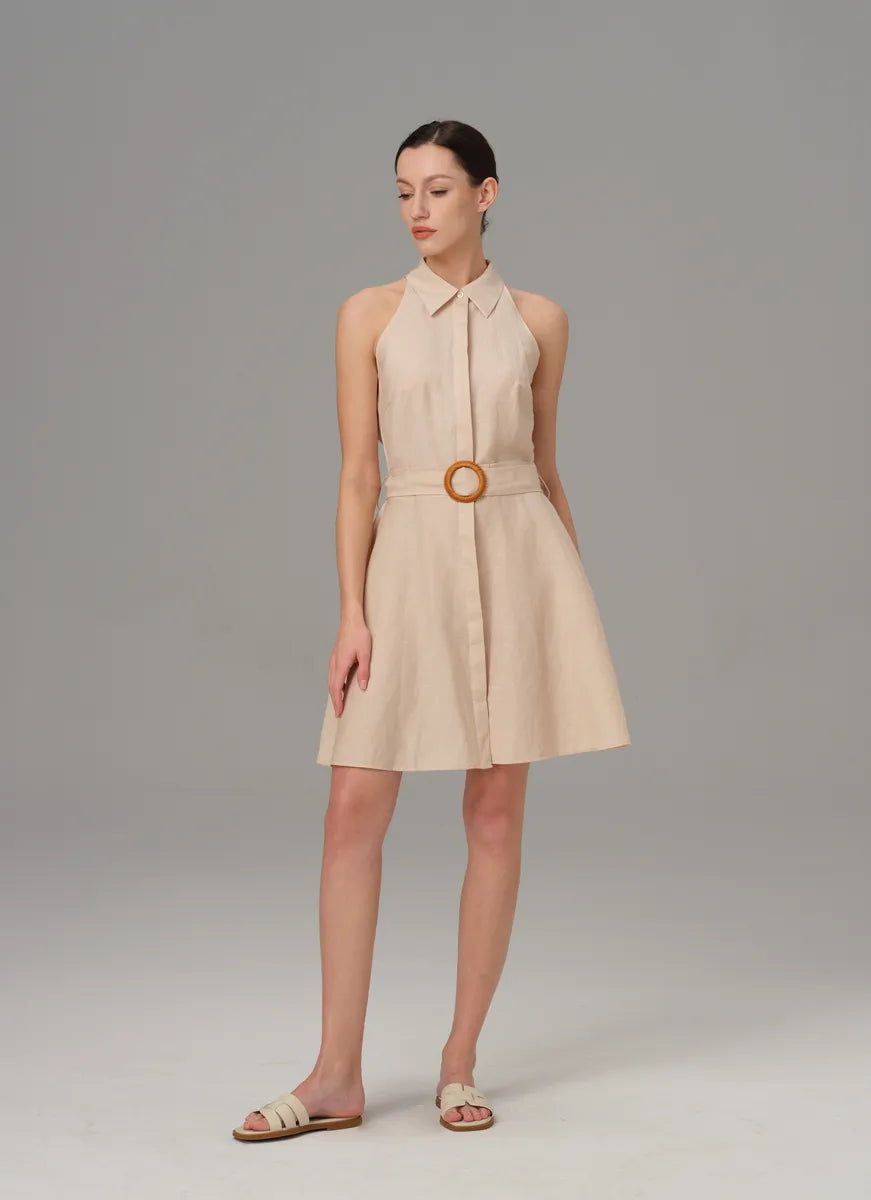 Woman wearing a beige sleeveless dress with a belt summer dresses gifts for her