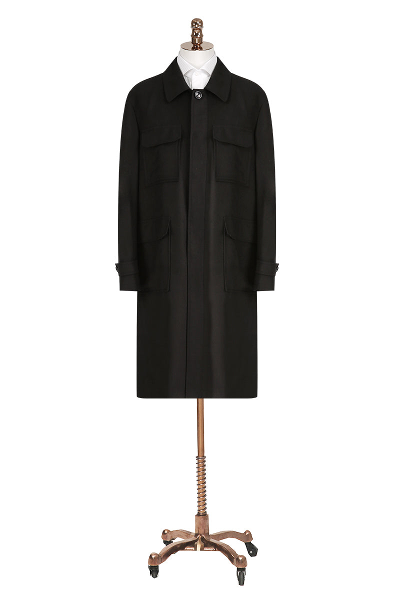Black coat on a mannequin with a white background