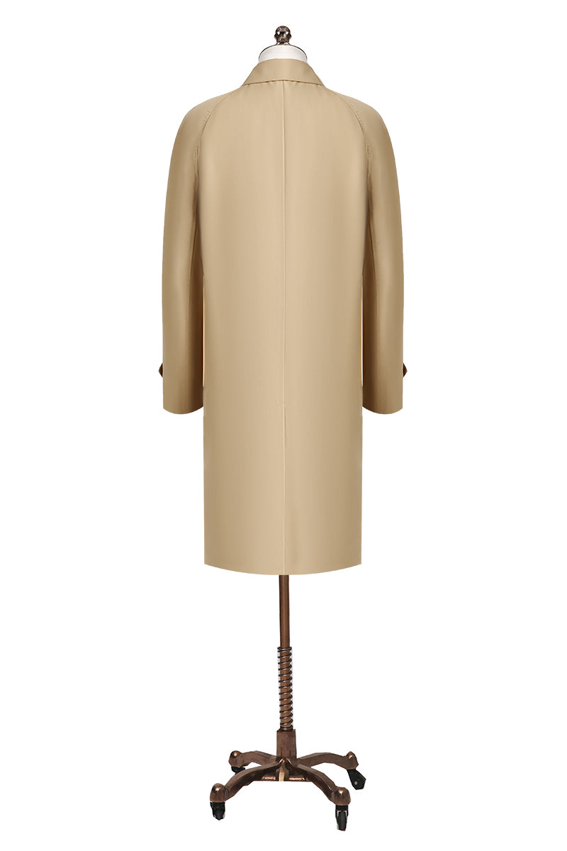 Beige coat on a mannequin with a white background