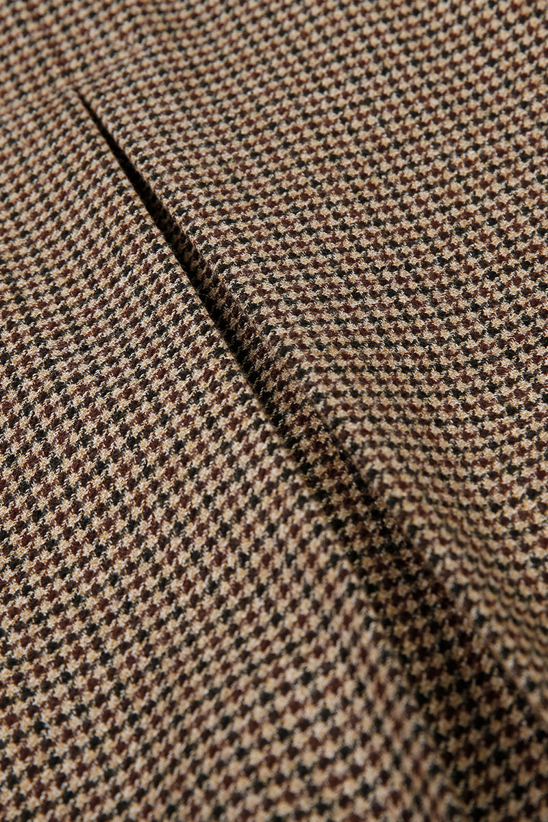 Close-up of brown and black houndstooth pattern fabric