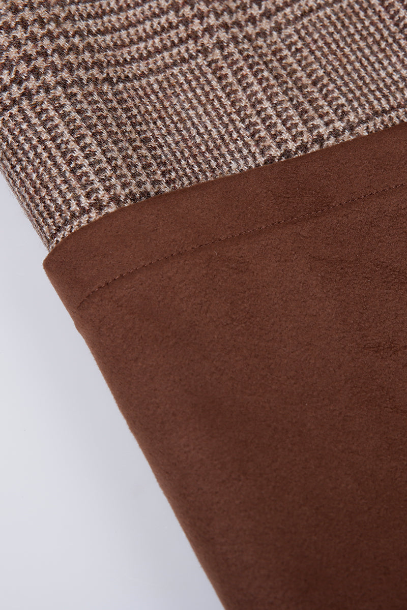 Close-up of brown fabric with a textured pattern on a white background