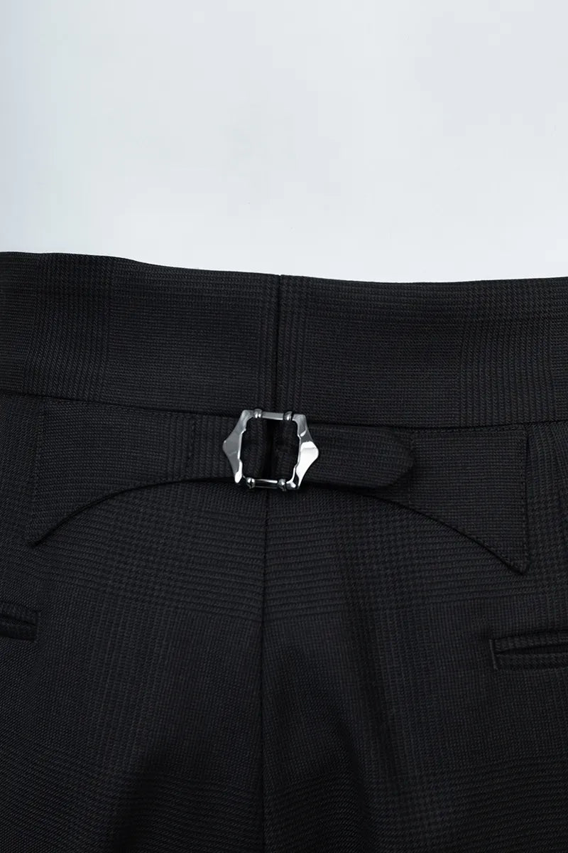 Close-up of black pants with a belt buckle on a light gray background custom suits italian fabrics shipping available 