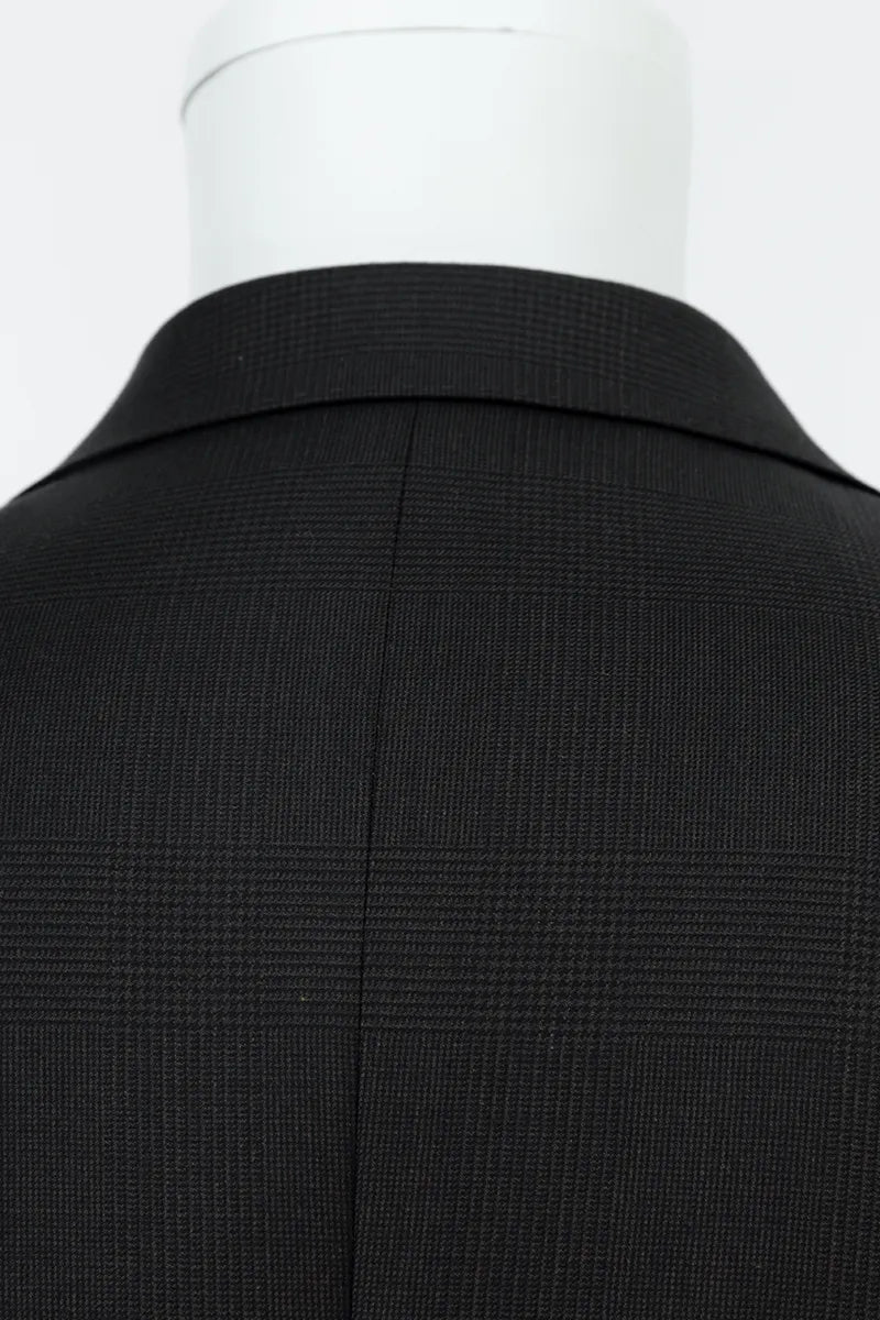 Black suit jacket on a mannequin with a white background tailored blazer