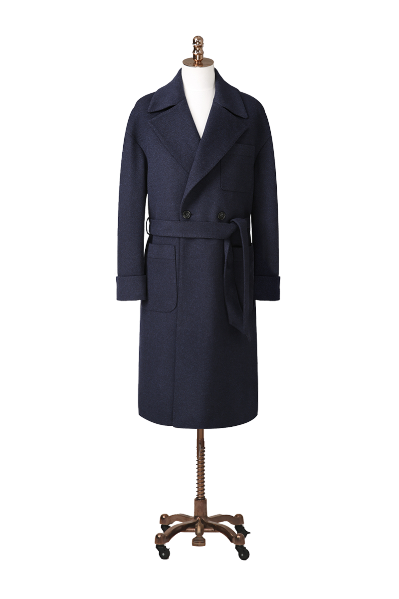 Navy blue coat on a mannequin against a white background