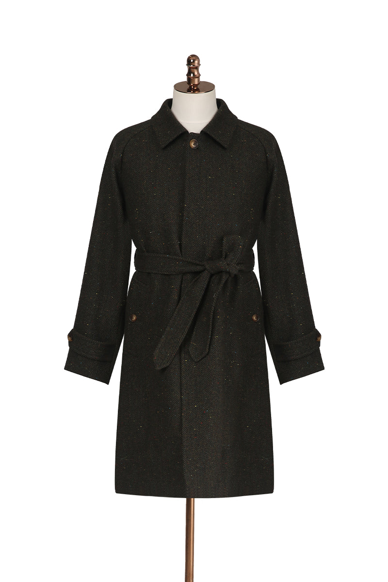 Black coat on a mannequin against a white background